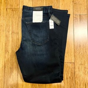 Banana Republic Traveler dark wash navy blue jeans.